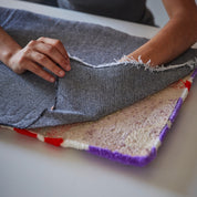 Tejido secundario para tufting